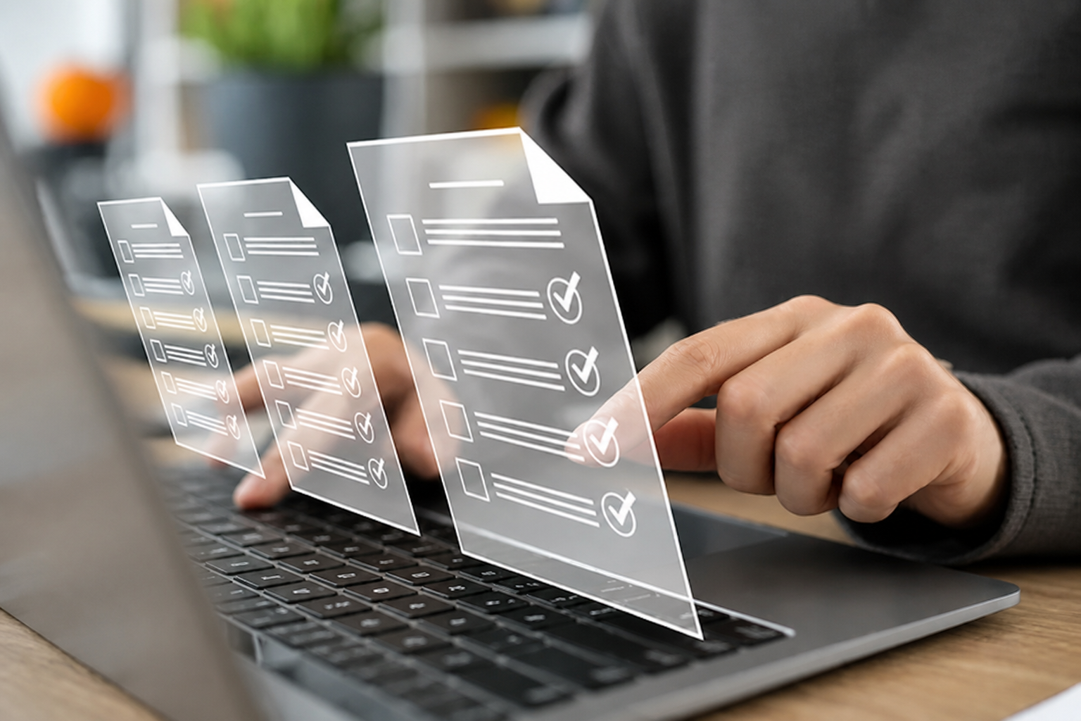 Person completing structured digital forms on a laptop